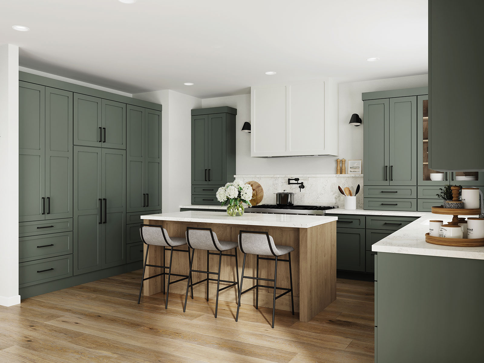 Olive green painted kitchen cabinets with white painted accents and a wood kitchen island.