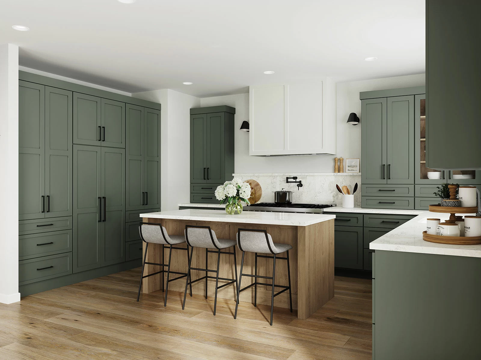 A modern farmhouse kitchen renovation with a combination of green painted and light stained wood cabinets with a white painted wood hood.