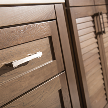 A close up of quality wood cabinet doors with a factory stained finish.